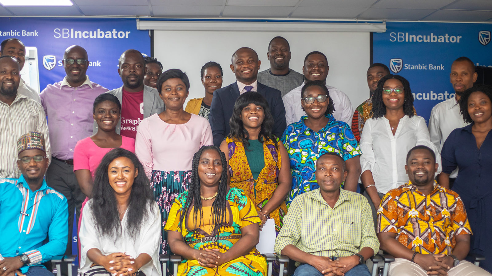Ghana explorer event guests sit for a group photograph