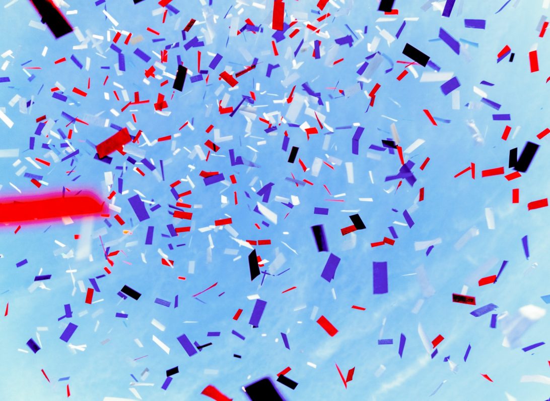 Red, white and blue confetti fills the sky