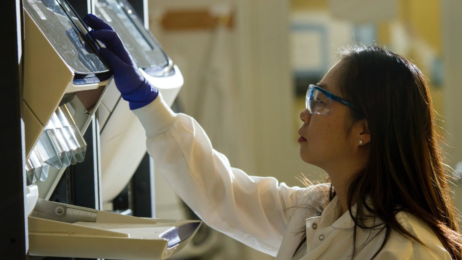 Scientist at National Cancer Institute checks equipment
