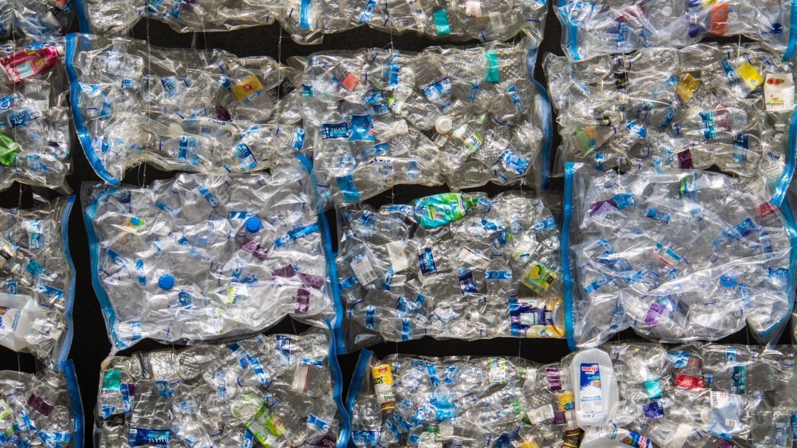 Bales of plastic waste await recycling