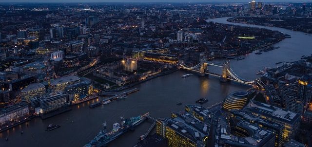 An aerial view of Tower Bridge, The Tower of London, City Hall and The Thames