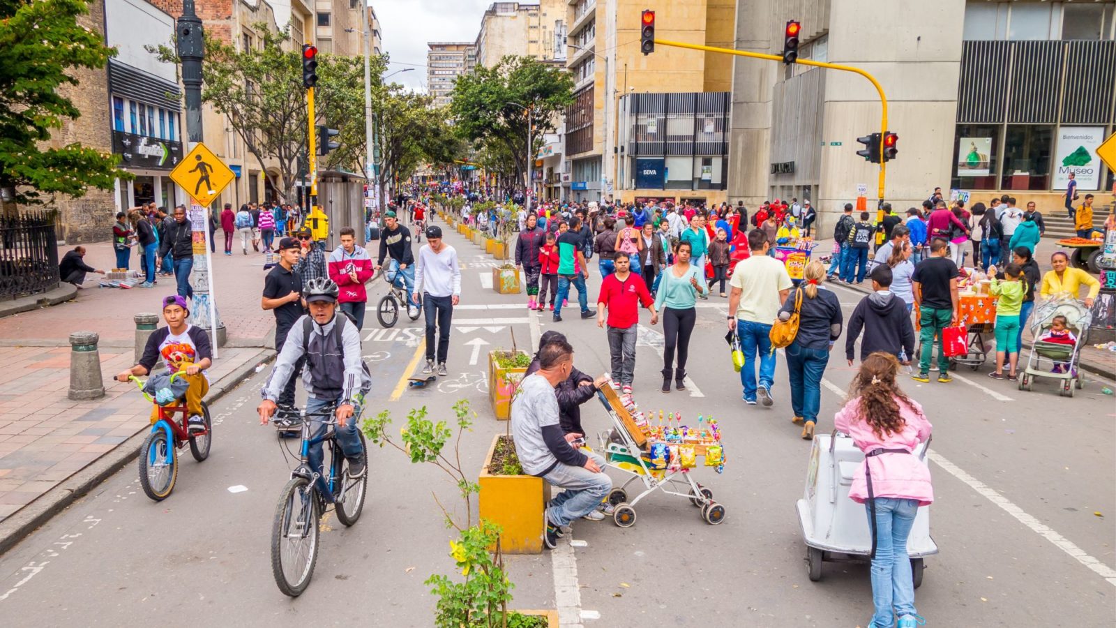 Busy street of pedestrians and cyclists no cars