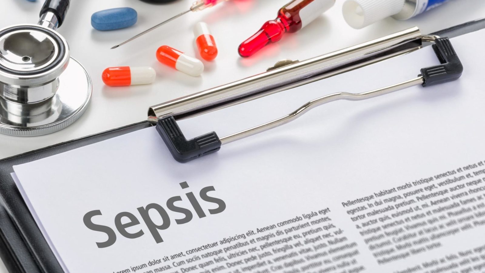 Sepsis paperwork and medical items on a desk