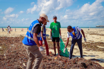 Innovators during a beach clean up