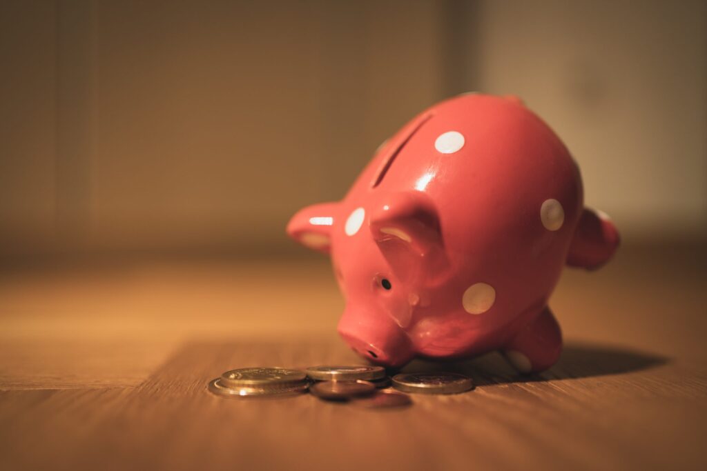 Piggy bank and coins|Hastee logo