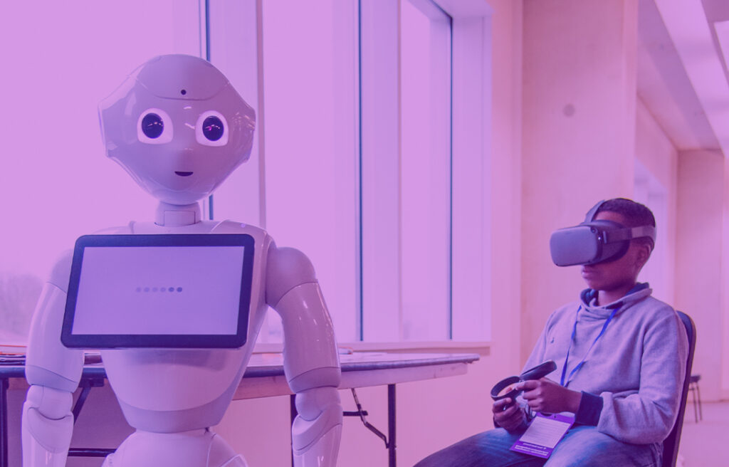 Boy sitting down with a VR headset on which is connected to and controlling a white humanoid robot|Amazon logo|An illustration shows how insects could digest plastic waste|An illustration shows how a product/hardware can record environmental data|Amazon logo