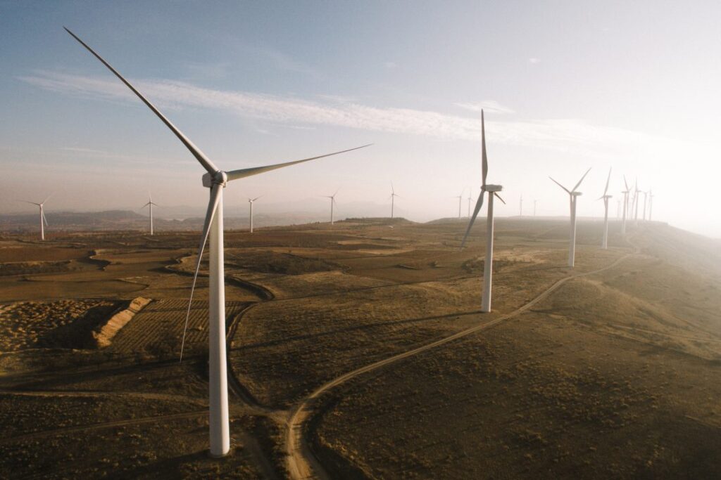 Models of wind turbines sit on an office desk