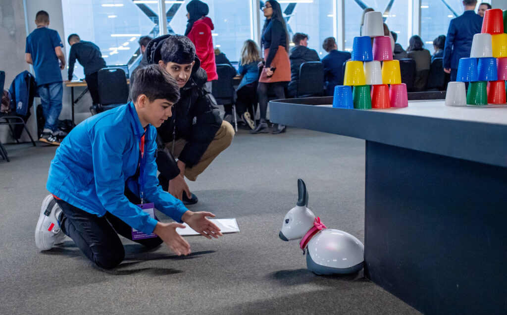 Two boys experiment with a robot animal|Department for Business