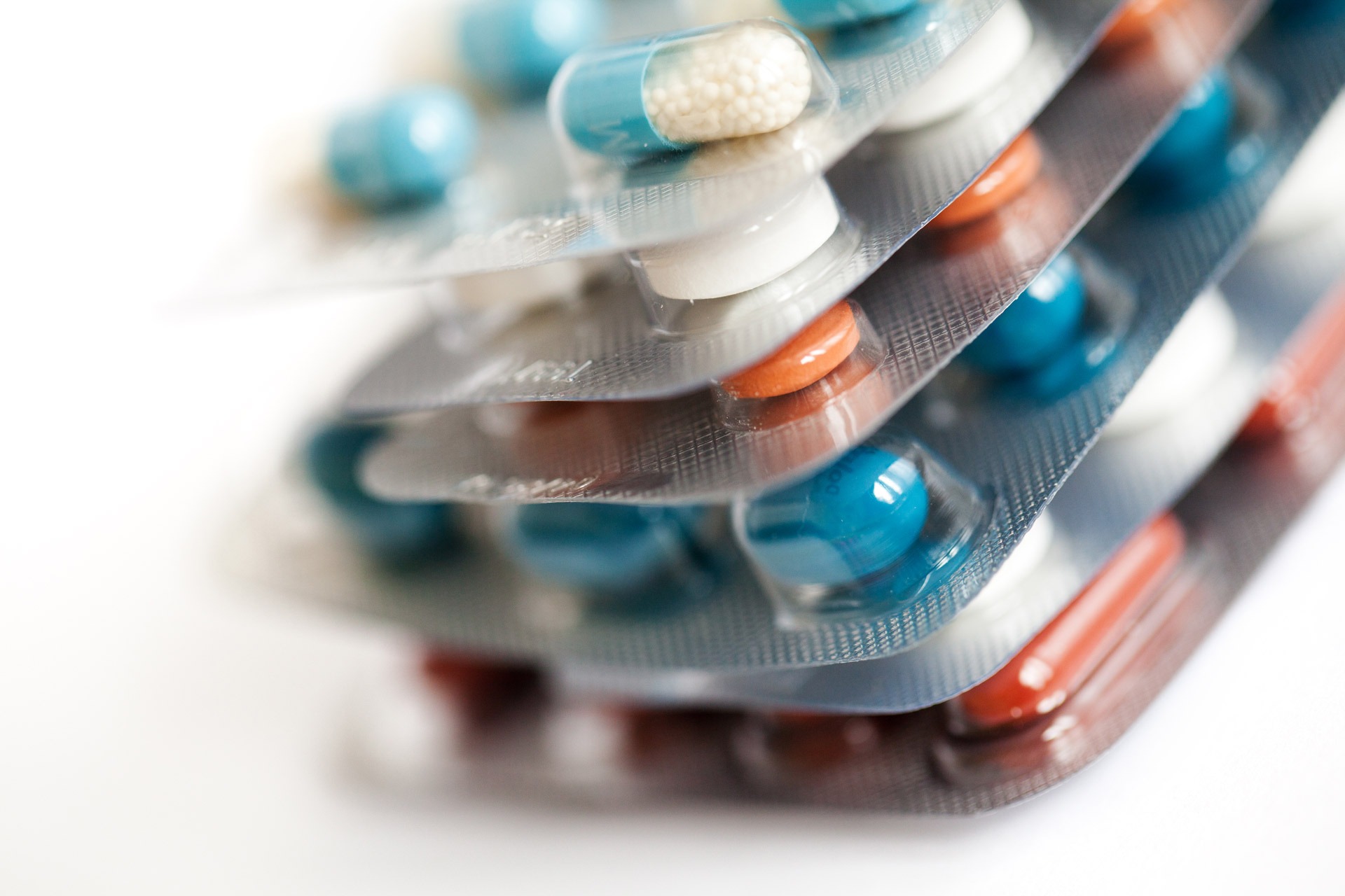 A stack of blisters of different types of pills