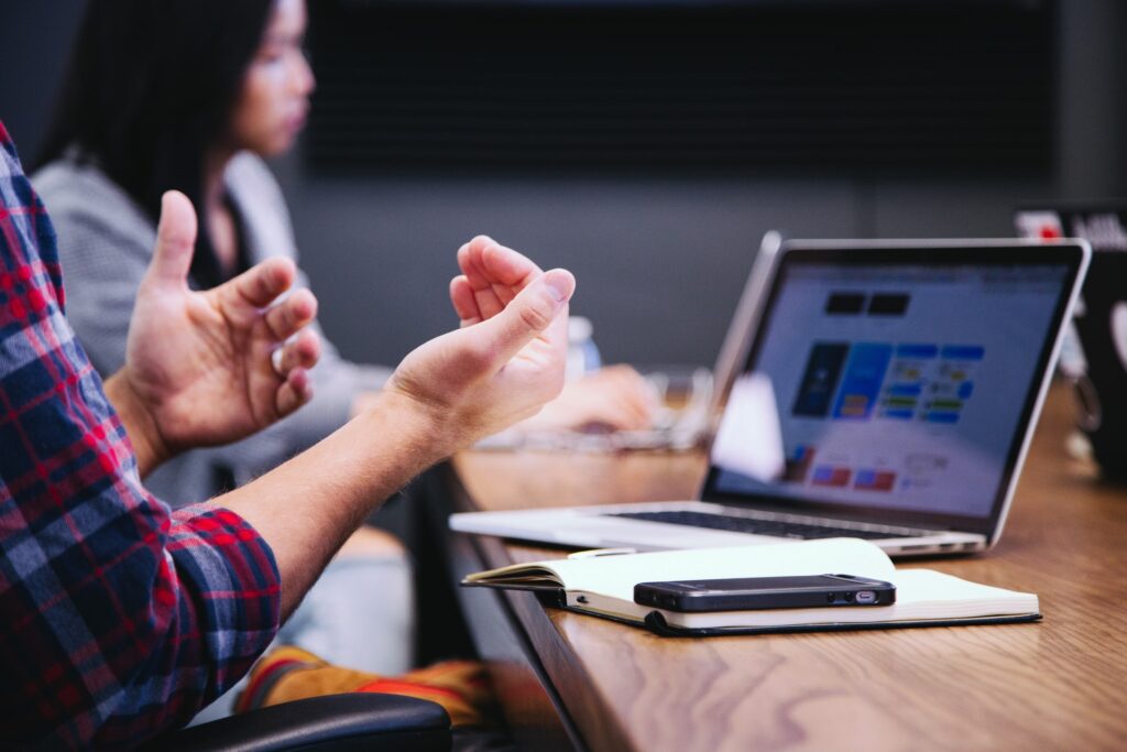 A pair of hands gesturing at a laptop screen|Happaning logo|MycoTEX logo