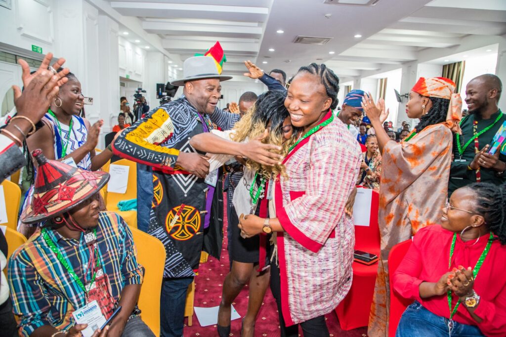 Home | Challenge Works | Finalists of the Afri-Plastics prize celebrate their win|Baus Taka|The image shows a woman wearing a virtual reality headset and holding VR controllers in both hands