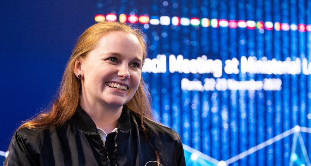 Meganne-Christian-Astronaut red hair smiling at the camera