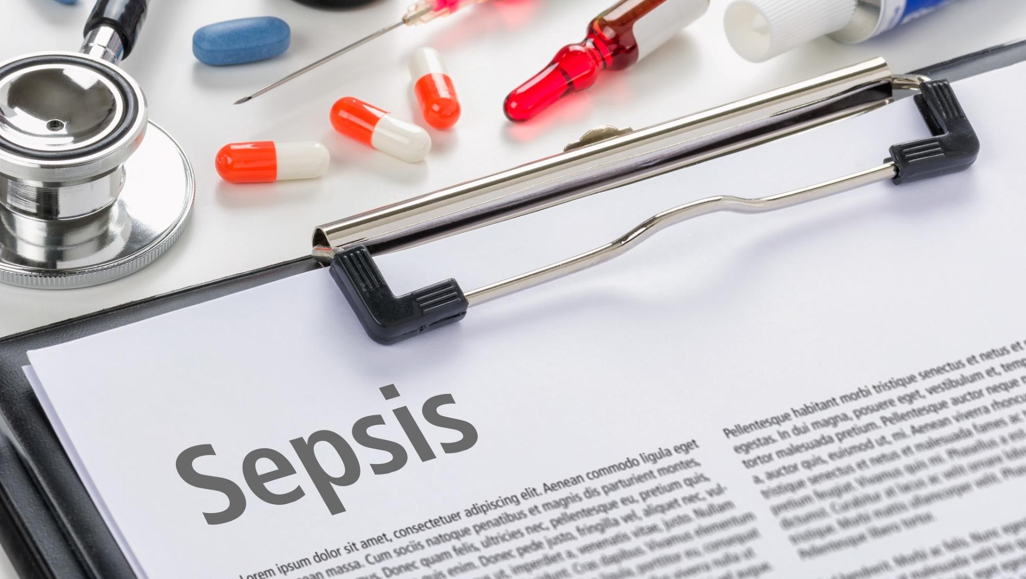 Sepsis paperwork and medical items on a desk|Longitude Prize - AMR Voices