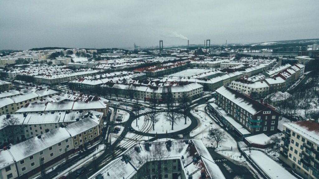 Aerial shot of a snowy city-scape in Sweden|Aerial shot of Hammarby Sjöstad