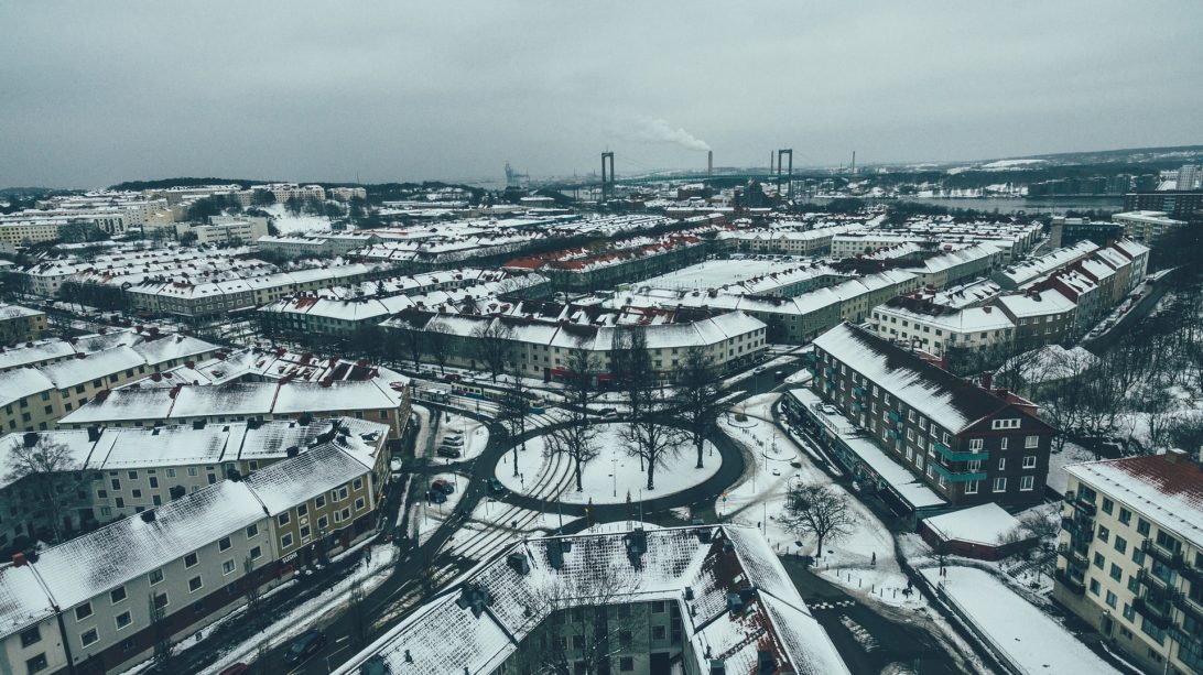 Aerial shot of a snowy city-scape in Sweden|Aerial shot of Hammarby Sjöstad