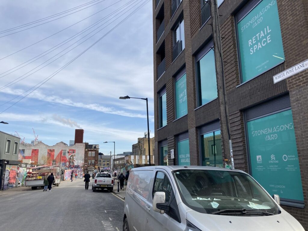 View of a car outside commercial spaces available to rent|Hackney Council logo|Hackney Council logo