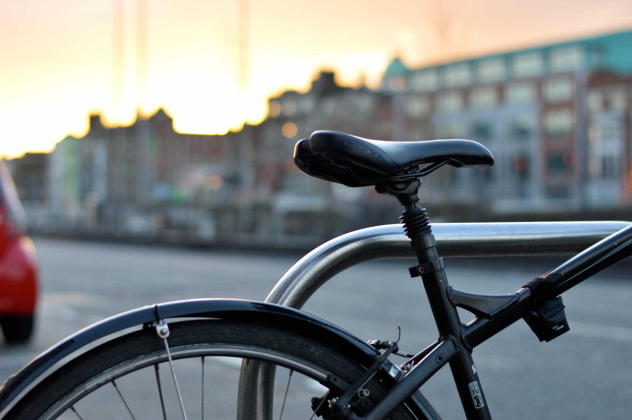A bike in front of a city|Stolen Bikes logo