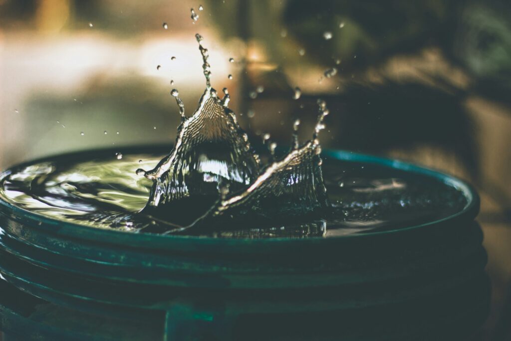 drops of water splashing into a puddle