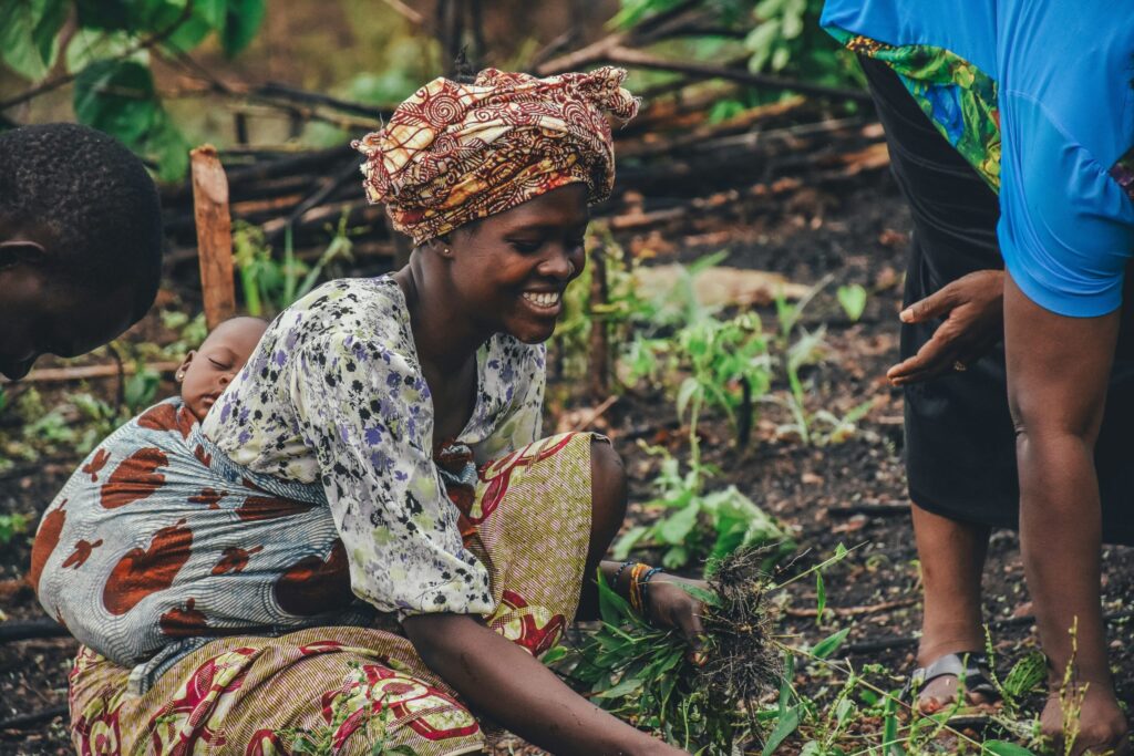 Woman in Sierra Leone holding grass