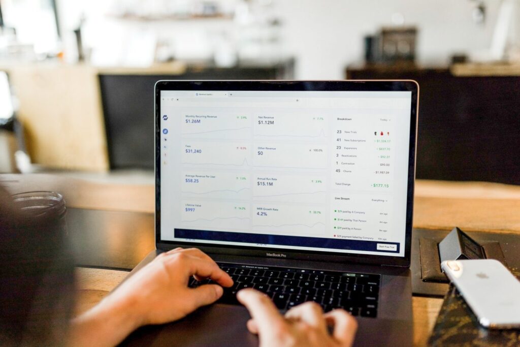 Person typing on a laptop|Coconut logo|Fluidly logo|Funding Circle logo|Funding Options logo|OpenWrks logo|Swoop logo