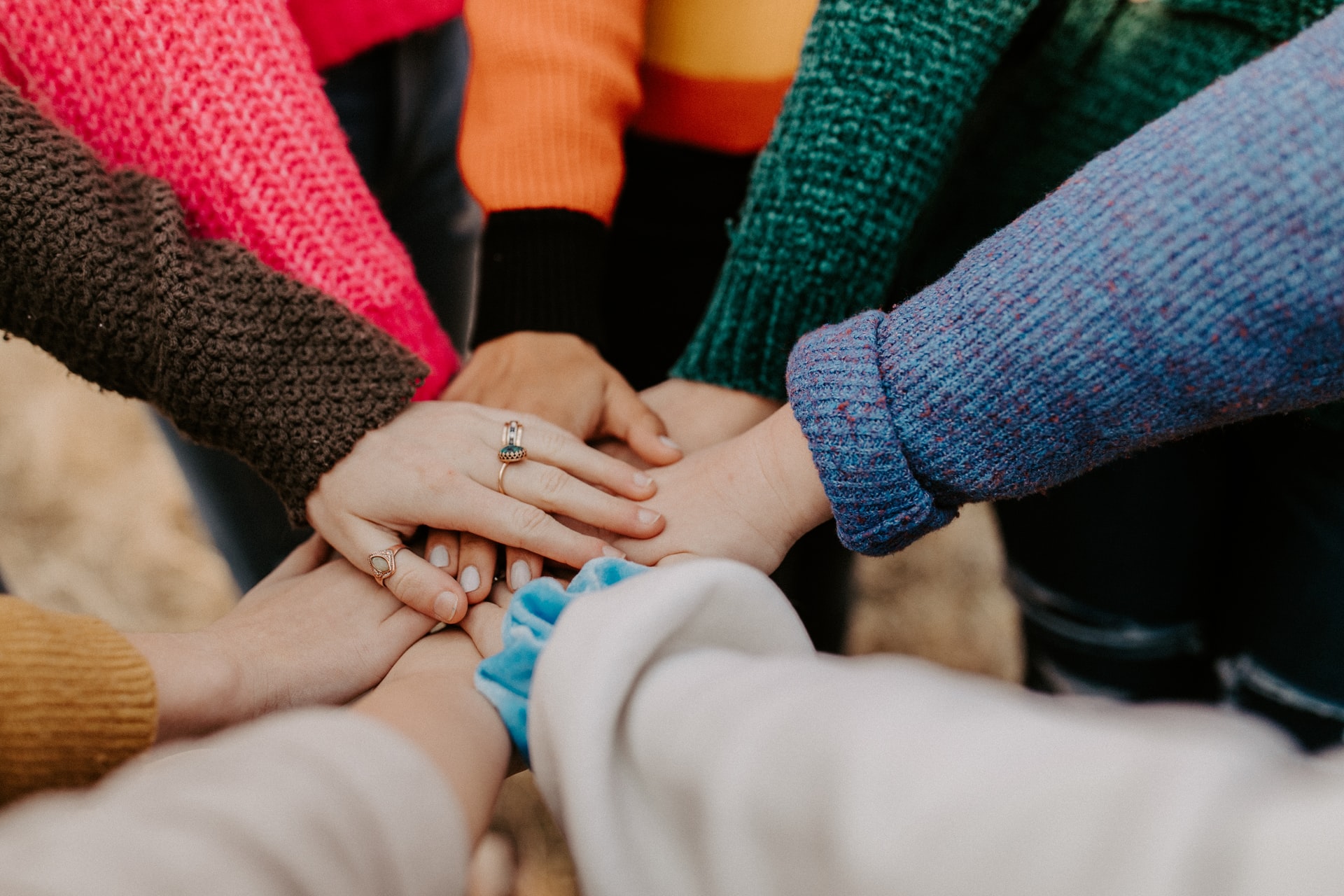 A circle of hands on top of each other