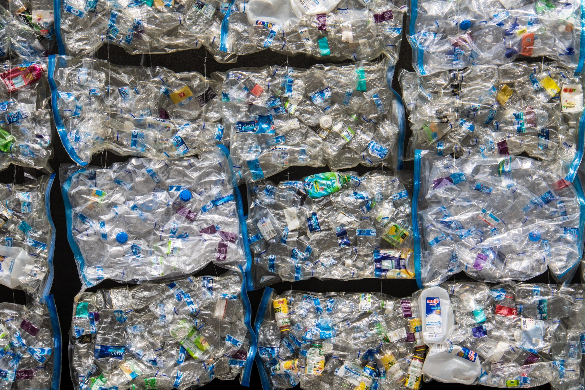 Bales of plastic waste await recycling