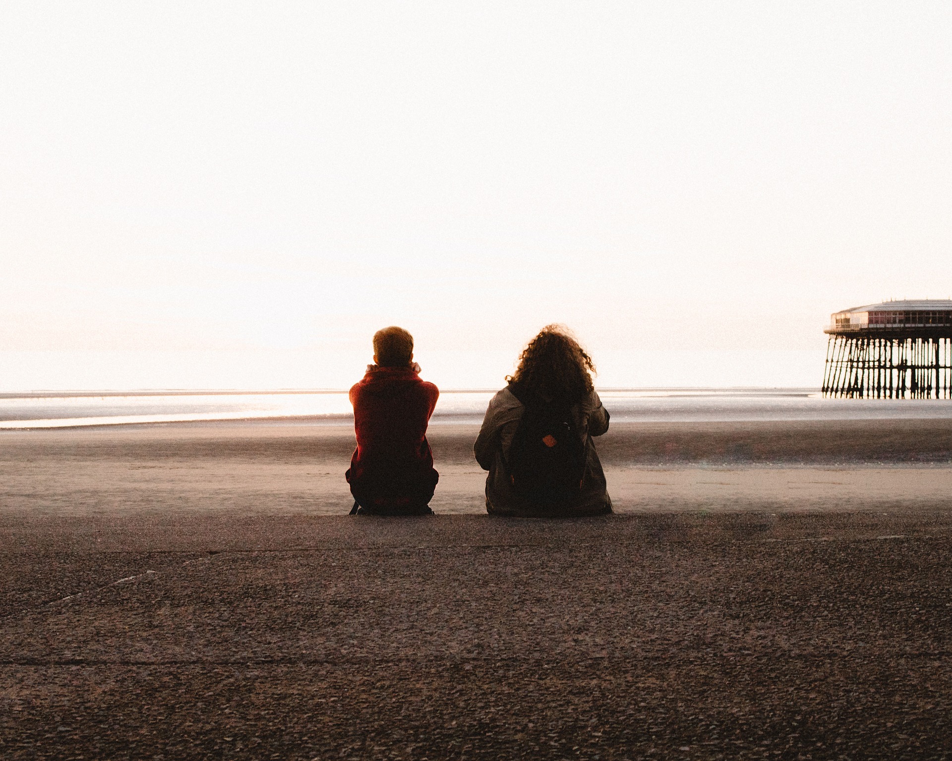 Two people sitting on a beach|Talk for Health logo|Lord Mayor's Appeal logo|PSYT app screenshot|The Money and Mental Health Policy Institute logo|Thrive logo