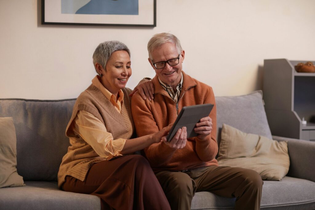 Two elder people sitting on the sofa using a tablet together.|Animorph logo|Clairvoyant Logo|Autonomous Logo|Supersense logo|Western sydney uni logo