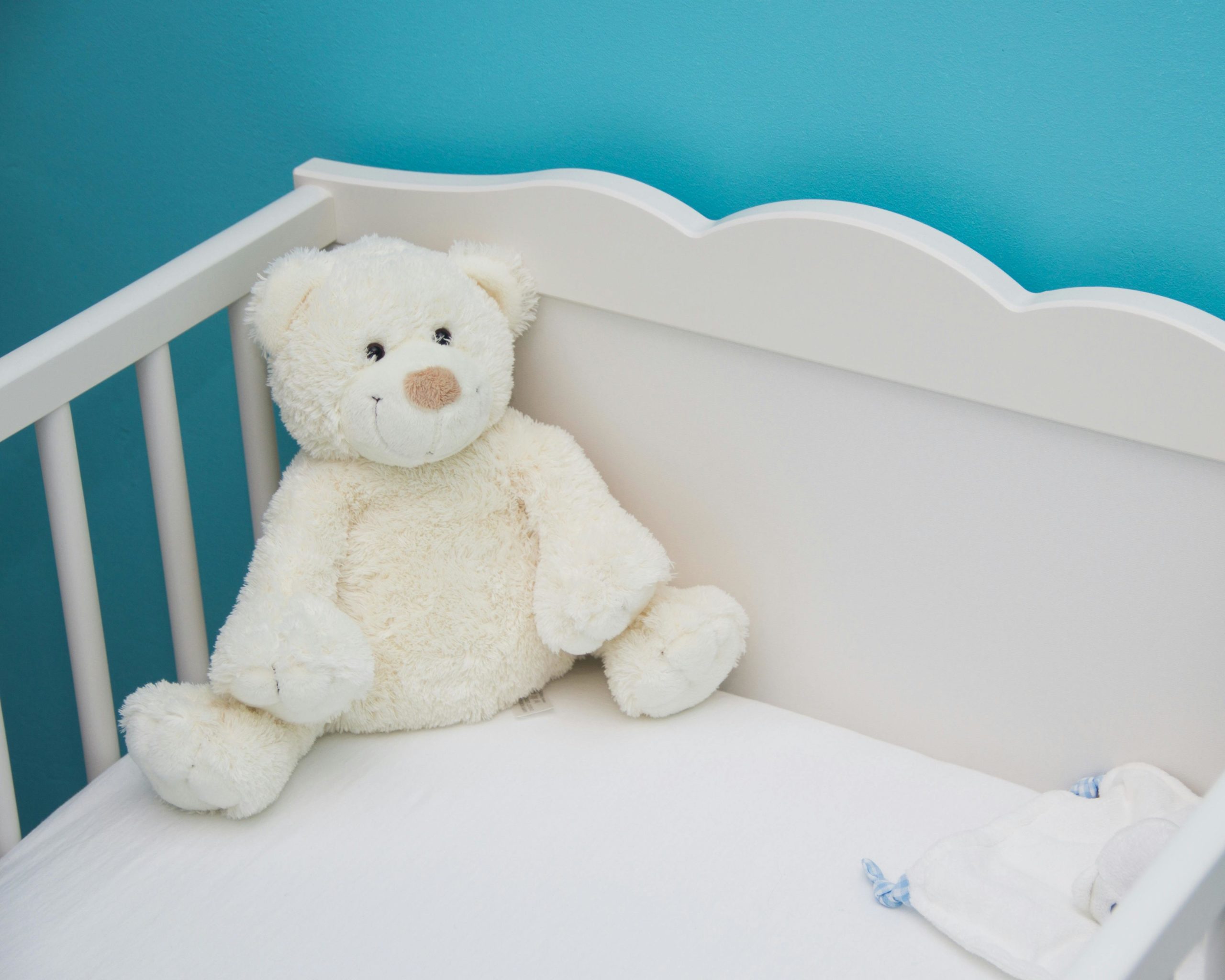 A white teddy sitting on the side of the cot.|Credit: UNICEF Ethiopia