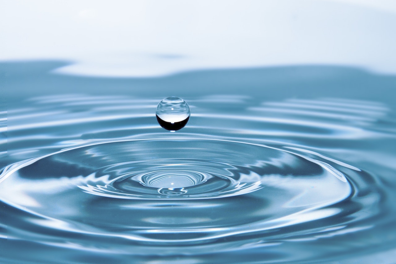 Water drop on the surface of water