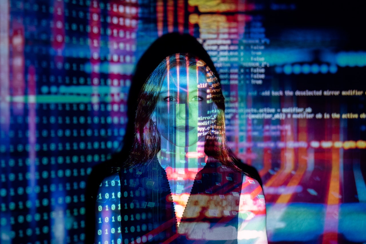 code projected over woman|Challenge Works logo