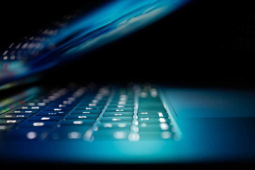 Close up on a laptop with a glowing screen