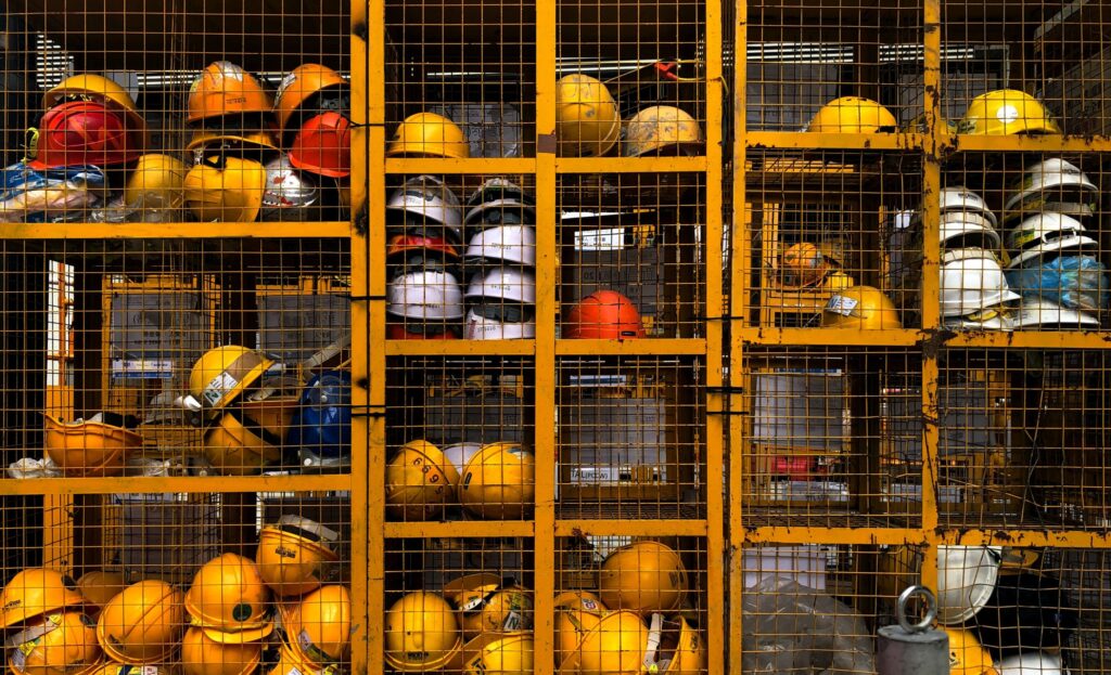 Construction hardhats in storage|Cabinet Office logo|Applied logo|Career Alchemy logo|A screenshot of the Connectr platform|Exceptional Individuals logo|Founders4Schools logo|A group of Toolshed trainees stand in a line wearing hardhats and hi vis jackets|UK Youth logo