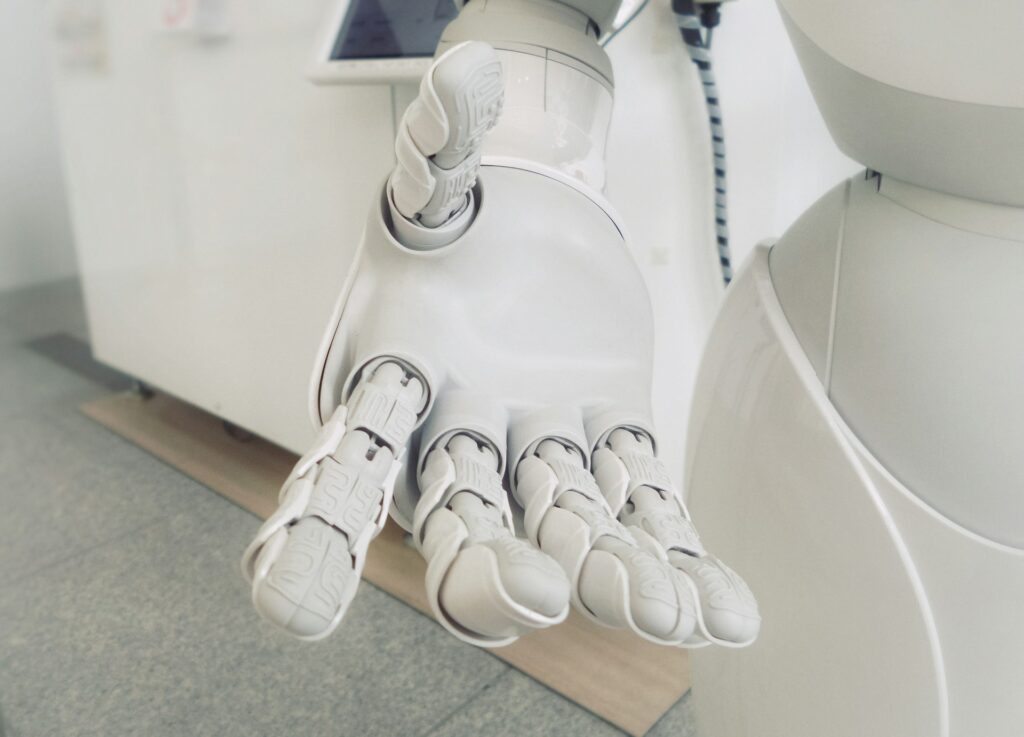 closeup photo of white robot hand