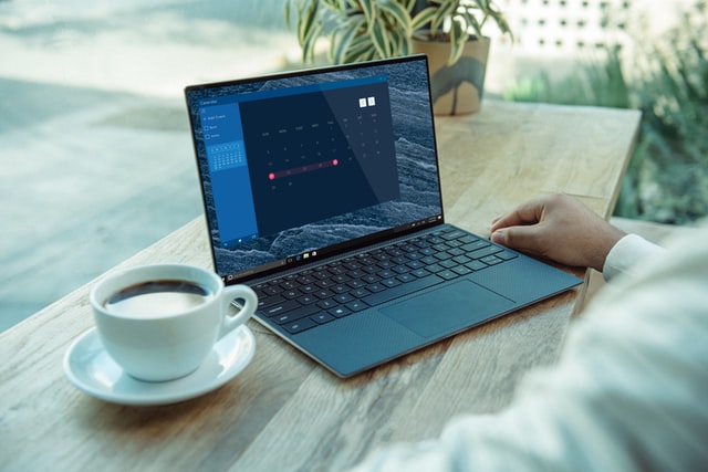 Person using a laptop|A group of older people